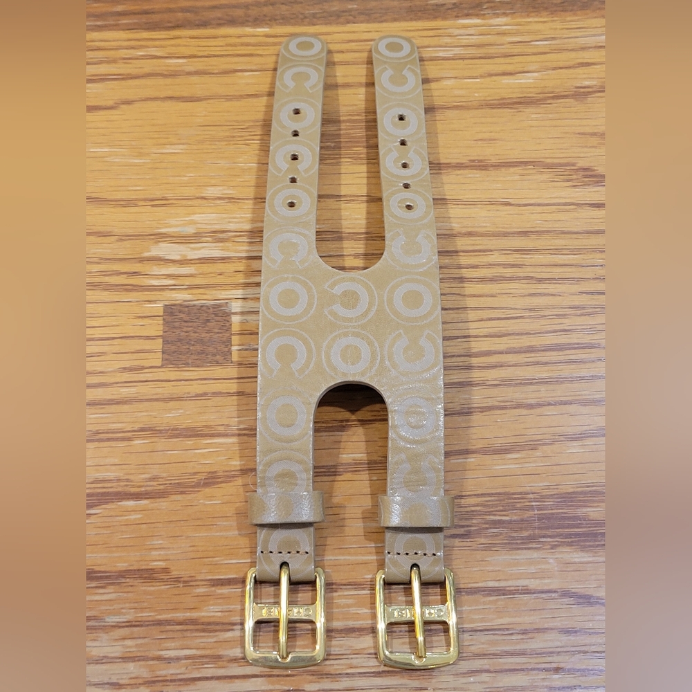 A tan leather double buckle CHANEL bracelet!